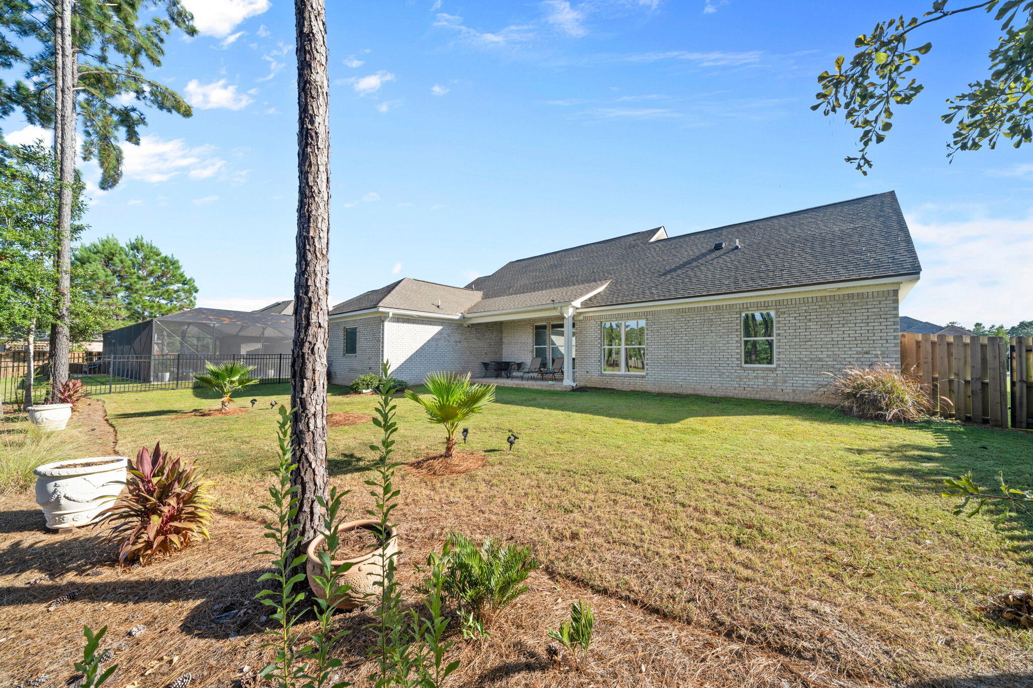 142 Mill Pond Cove Freeport, FL 32439 - Photo 54 of 109 a front view of a house with a yard