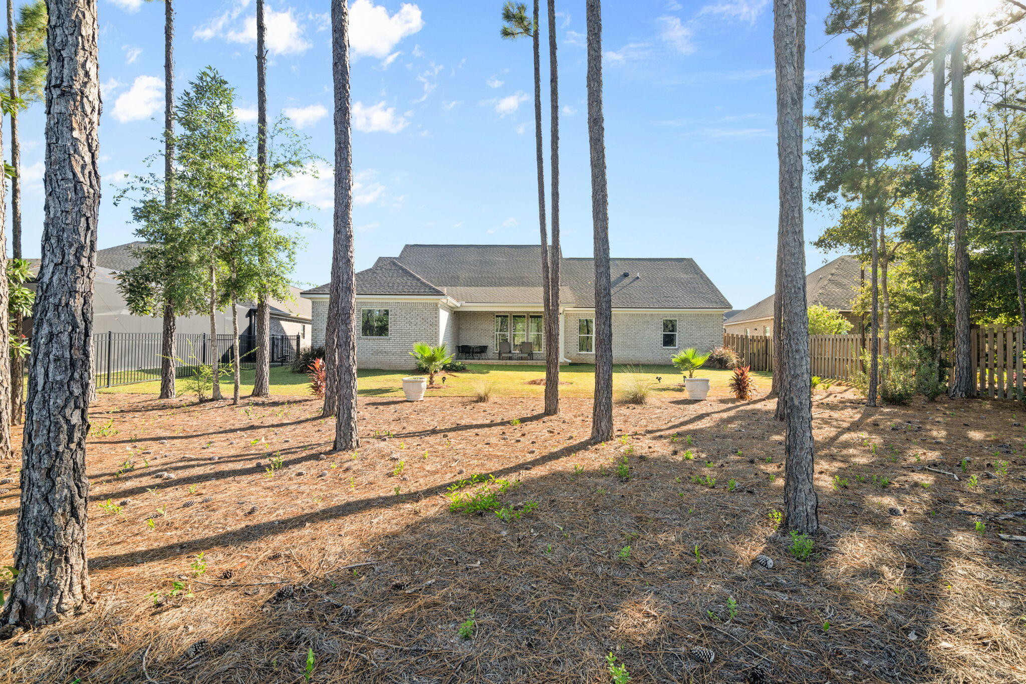 142 Mill Pond Cove Freeport, FL 32439 - Photo 58 of 109 a view of a house with a yard and sitting area