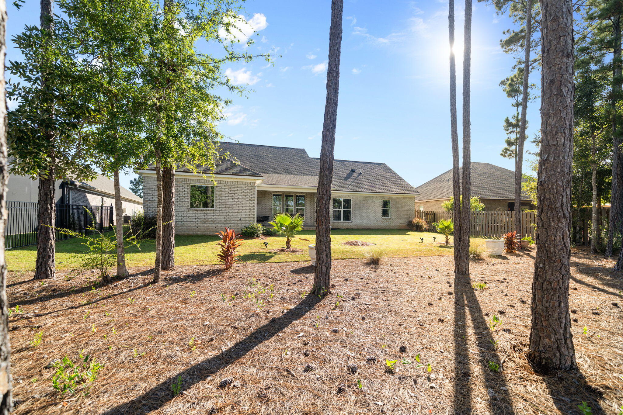 142 Mill Pond Cove Freeport, FL 32439 - Photo 59 of 109 a view of a backyard with a garden