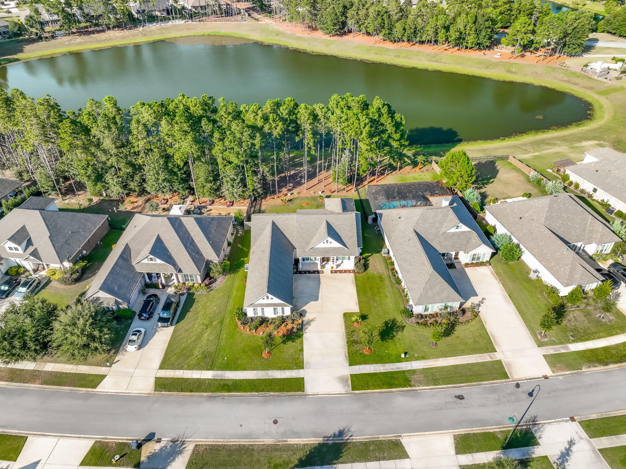 142 Mill Pond Cove Freeport, FL 32439 - Photo 67 of 109 an aerial view of residential houses with outdoor space and lake view