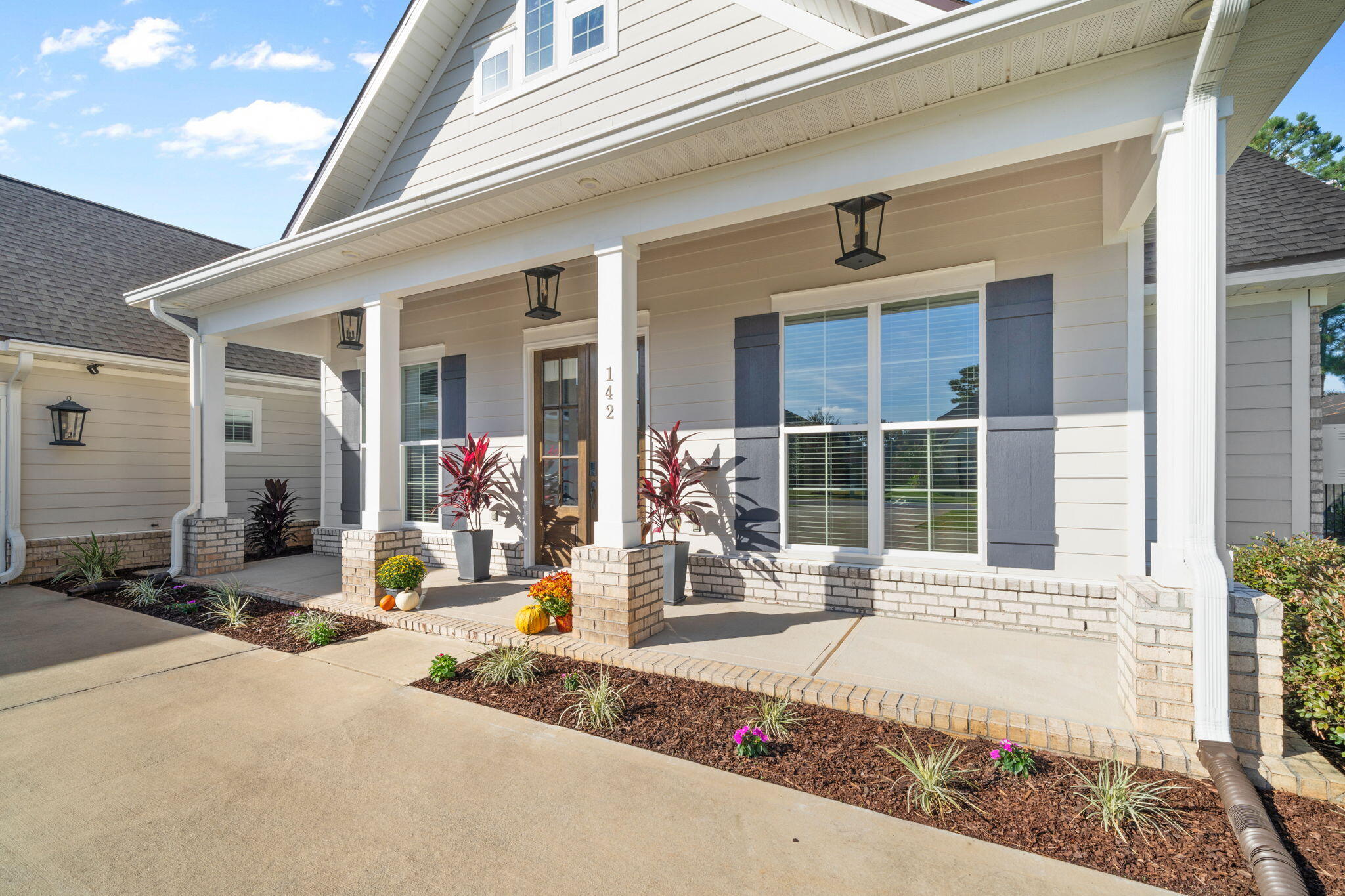 142 Mill Pond Cove Freeport, FL 32439 - Photo 7 of 109 a front view of a house