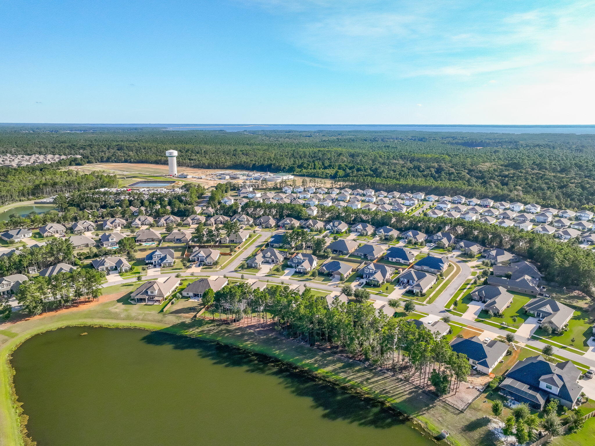 142 Mill Pond Cove Freeport, FL 32439 - Photo 71 of 109 an aerial view of residential houses with outdoor space and trees