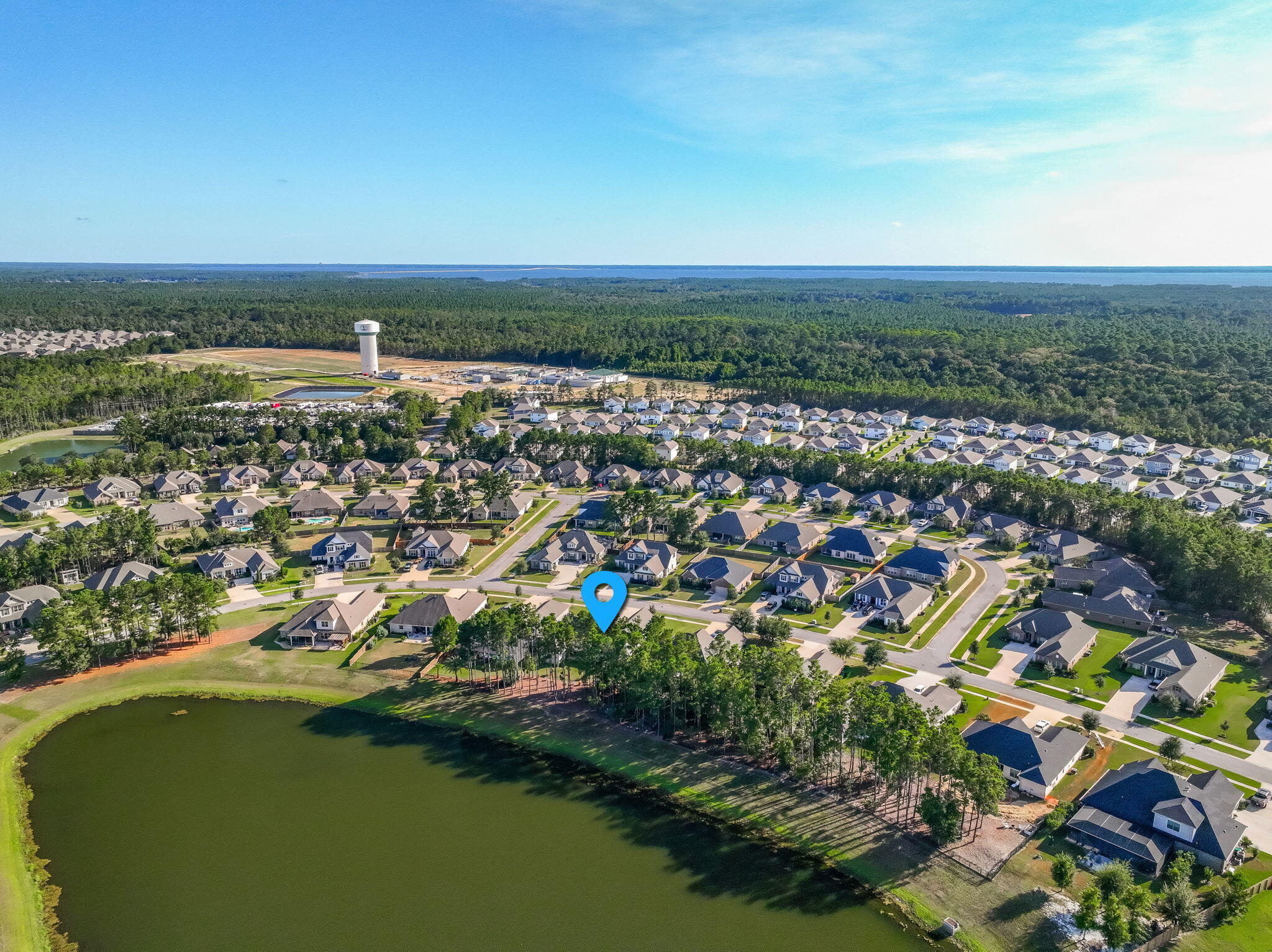 142 Mill Pond Cove Freeport, FL 32439 - Photo 79 of 109 an aerial view of residential houses with outdoor space and trees