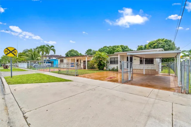 a view of a backyard with swimming pool