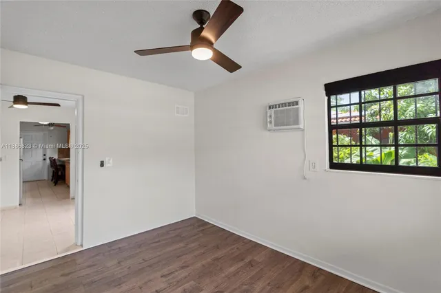 a view of a kitchen with a sink and cabinets
