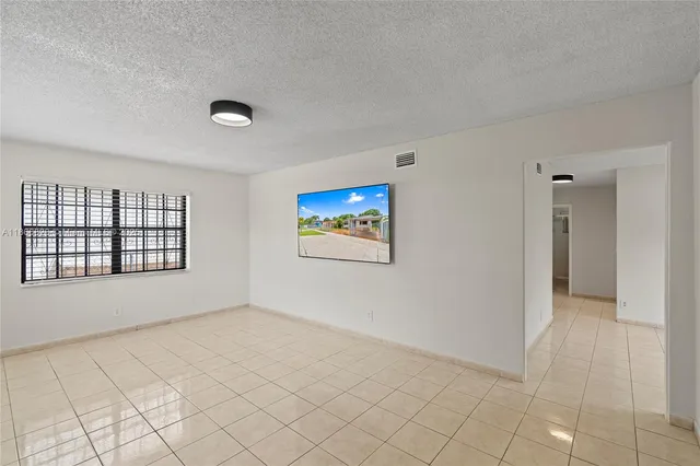 a view of an empty room and window