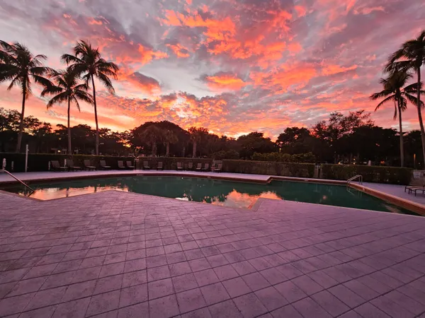 a view of swimming pool with an outdoor space and seating area