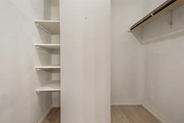 a view of an empty walk in closet