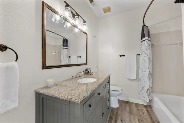 a view of a patio with couches and table and potted plants