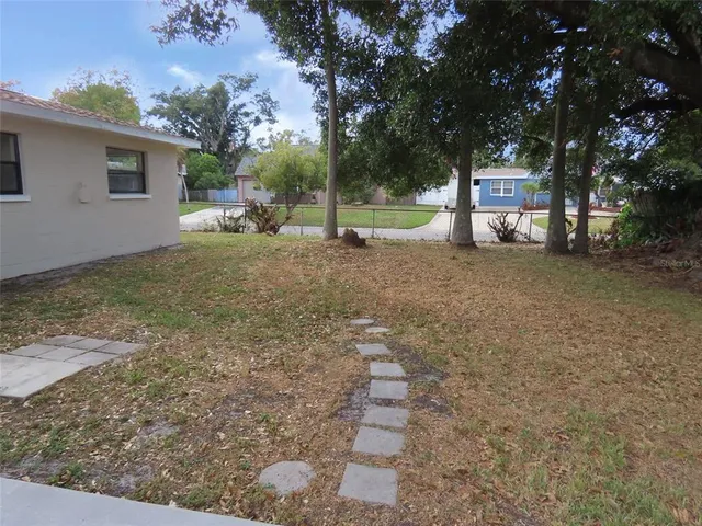 a view of a tree in front of a house
