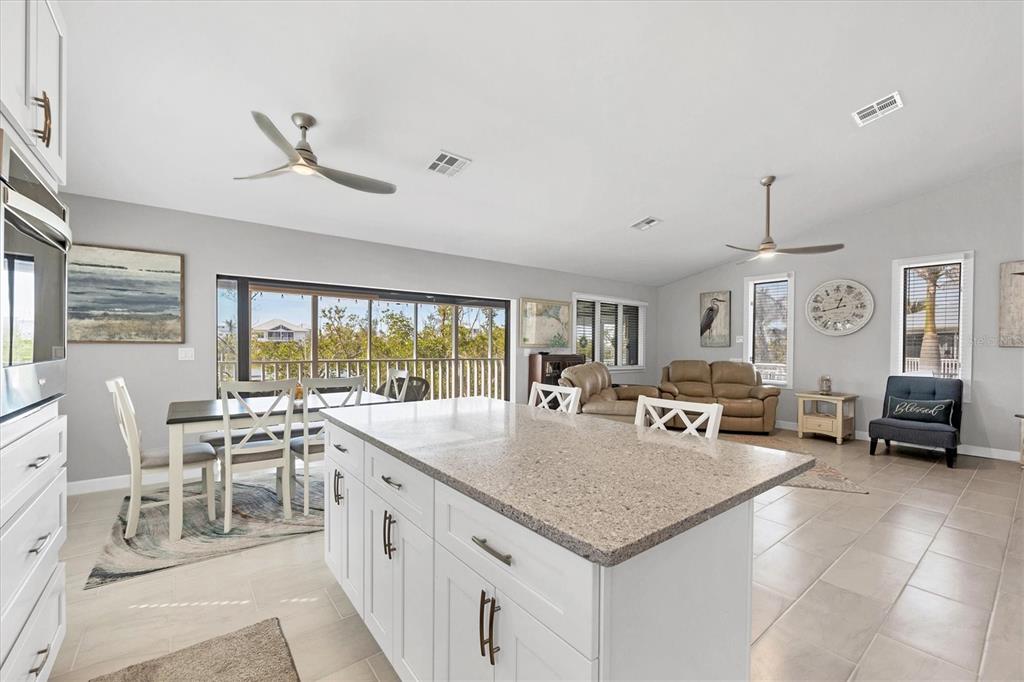 331 Bocilla Drive Boca Grande, FL 33921 - Photo 15 of 34 a open kitchen with stainless steel appliances granite countertop a sink and cabinets