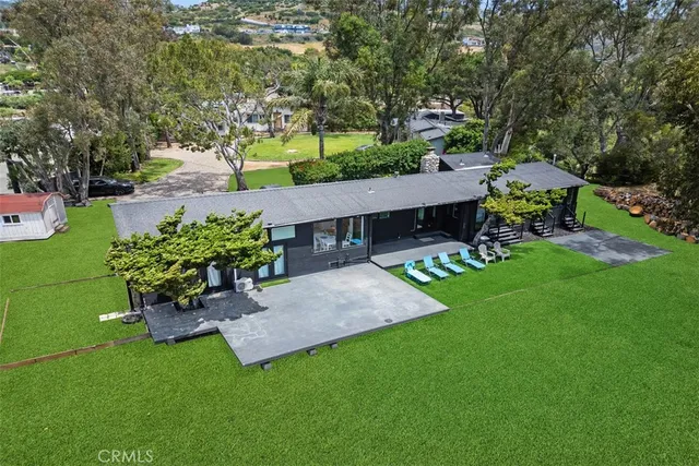 a view of a house with a tree