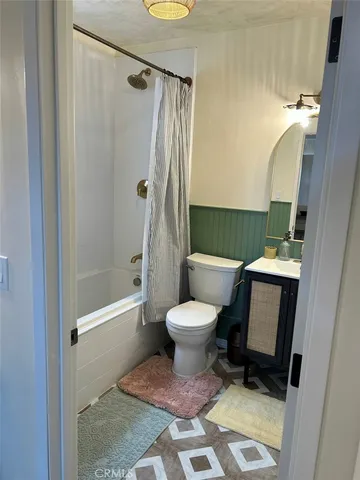 a view of a house with a yard patio and a garden