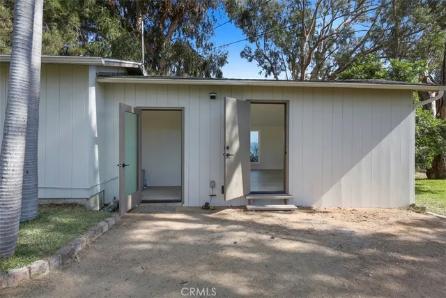 a house with trees in the background