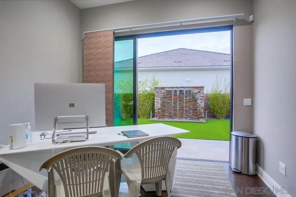 2575 Glasgow Drive Carlsbad, CA 92010 - Photo 20 of 43 a living room with a table and a fireplace