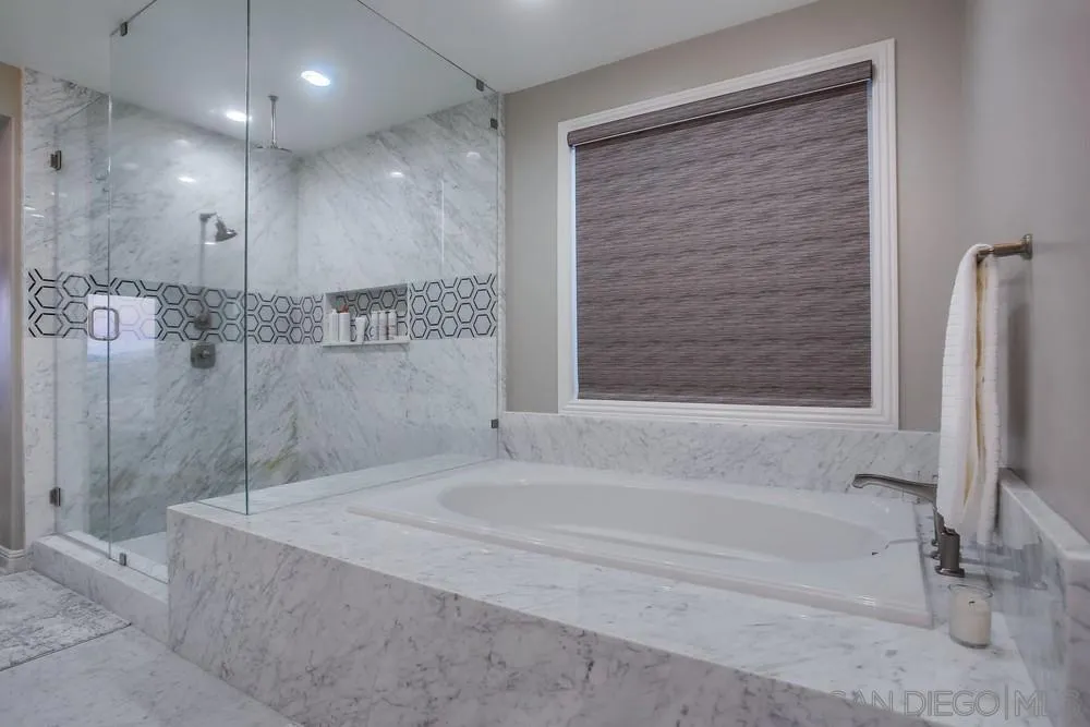 2575 Glasgow Drive Carlsbad, CA 92010 - Photo 23 of 43 a bathroom with a bathtub and a shower