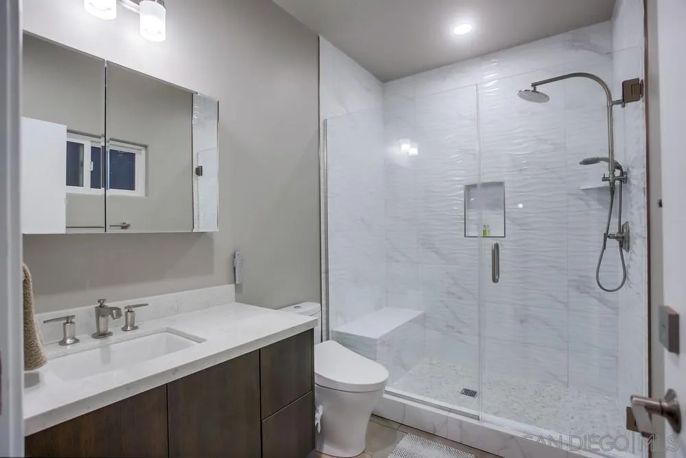 2575 Glasgow Drive Carlsbad, CA 92010 - Photo 32 of 43 a bathroom with a granite countertop sink toilet and shower