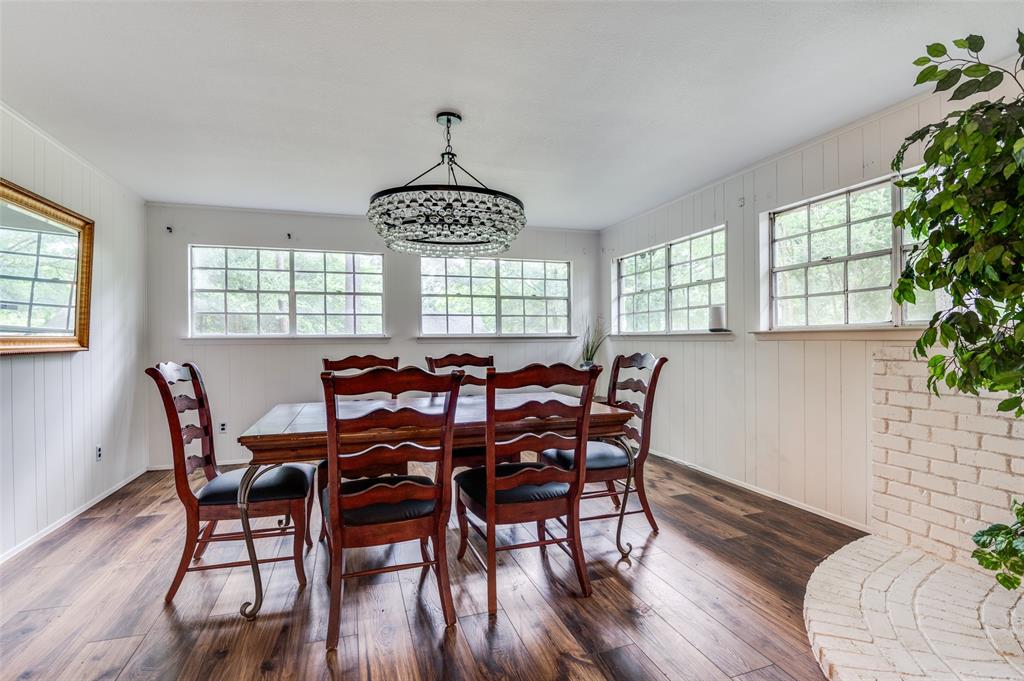 606 Quiram Lane Kemp, TX 75143 - Photo 11 of 23 a view of a dining room with furniture window and wooden floor
