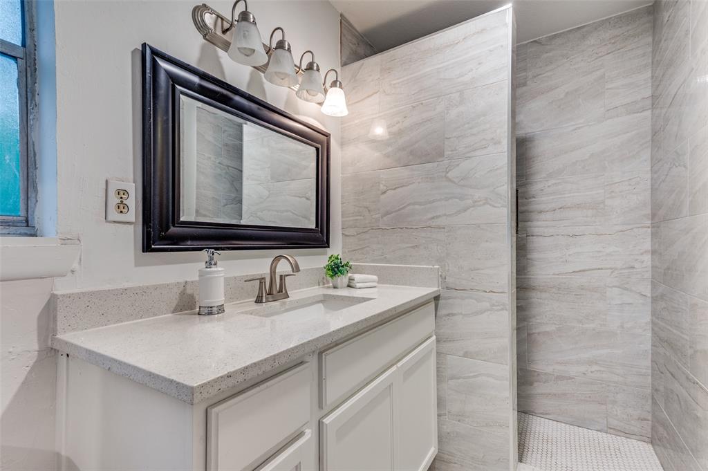 606 Quiram Lane Kemp, TX 75143 - Photo 14 of 23 a bathroom with a sink vanity and a mirror
