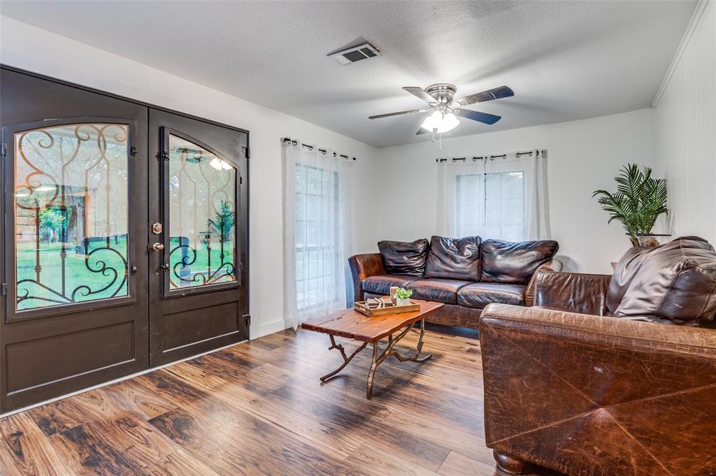 606 Quiram Lane Kemp, TX 75143 - Photo 4 of 23 a living room with furniture and a large window