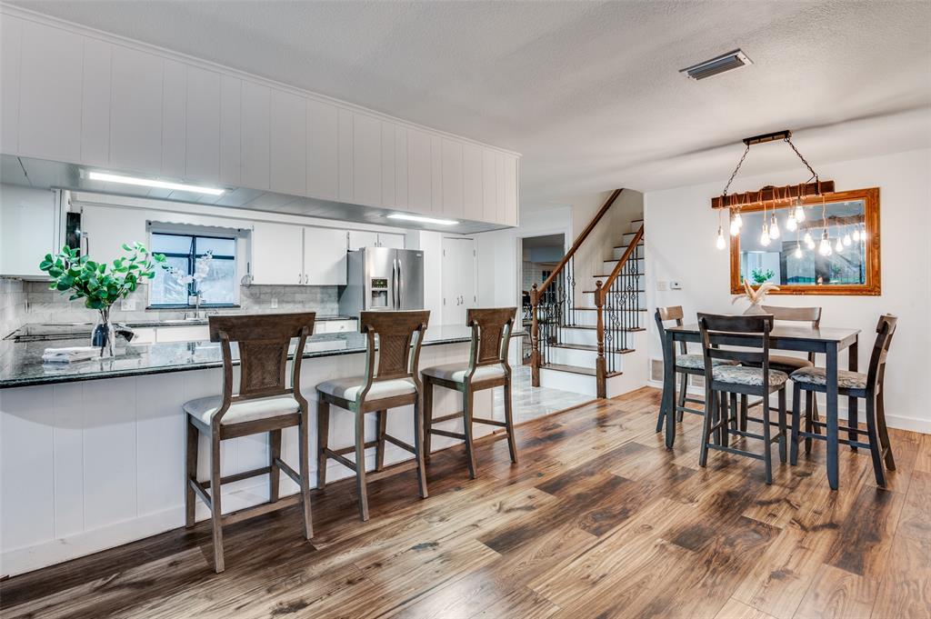 606 Quiram Lane Kemp, TX 75143 - Photo 7 of 23 a dining room with furniture and wooden floor