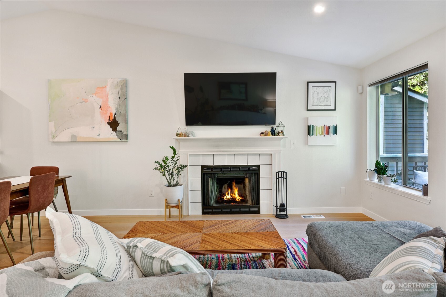 5126 South Garden Loop Road, Unit 11 Seattle, WA 98118 - Photo 9 of 36 a living room with furniture fireplace and flat screen tv