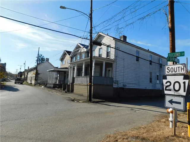 a view of a house with a street