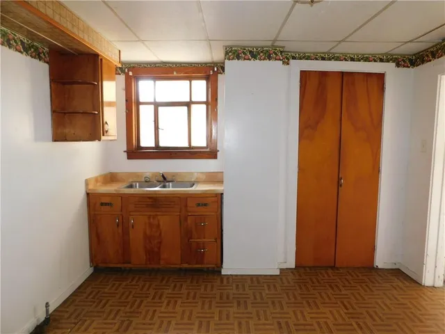 a view of entryway with window and wooden floor