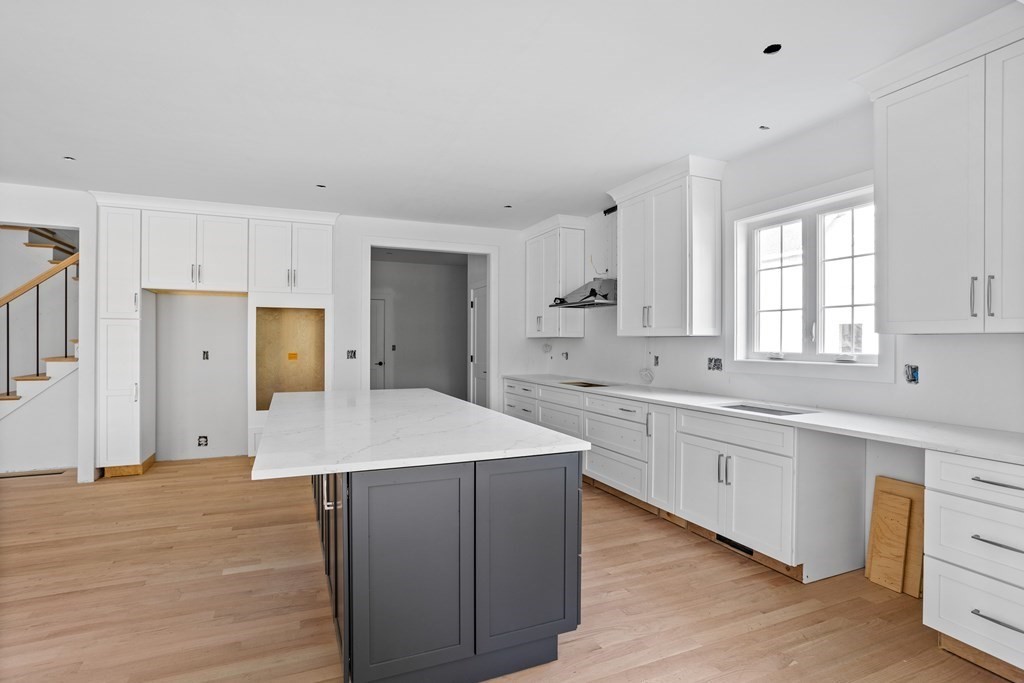 6 Nashoba Road Acton, MA 01720 - Photo 11 of 42 a kitchen with white cabinets appliances and sink