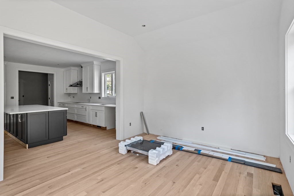6 Nashoba Road Acton, MA 01720 - Photo 12 of 42 a room with a wooden floor and white walls