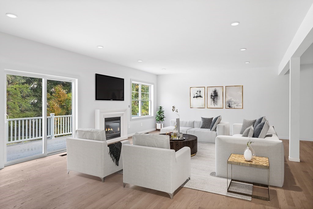 6 Nashoba Road Acton, MA 01720 - Photo 22 of 42 a living room with fireplace furniture and a flat screen tv