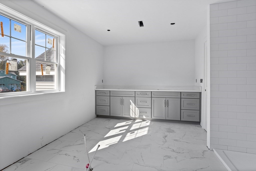 6 Nashoba Road Acton, MA 01720 - Photo 30 of 42 a view of a livingroom with an empty space and a window