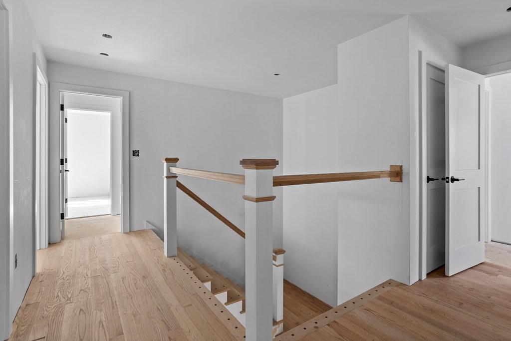 6 Nashoba Road Acton, MA 01720 - Photo 35 of 42 a view of hallway with wooden floor