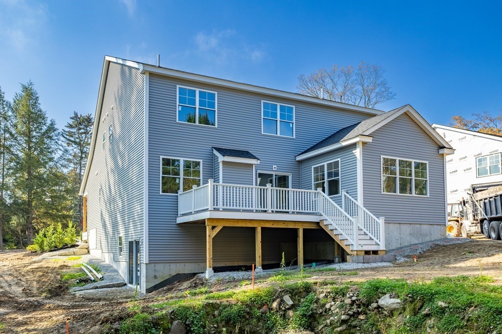 6 Nashoba Road Acton, MA 01720 - Photo 40 of 42 a front view of a house with a yard