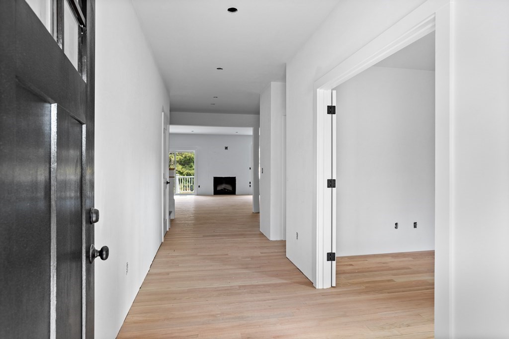 6 Nashoba Road Acton, MA 01720 - Photo 4 of 42 a view of a hallway with wooden floor