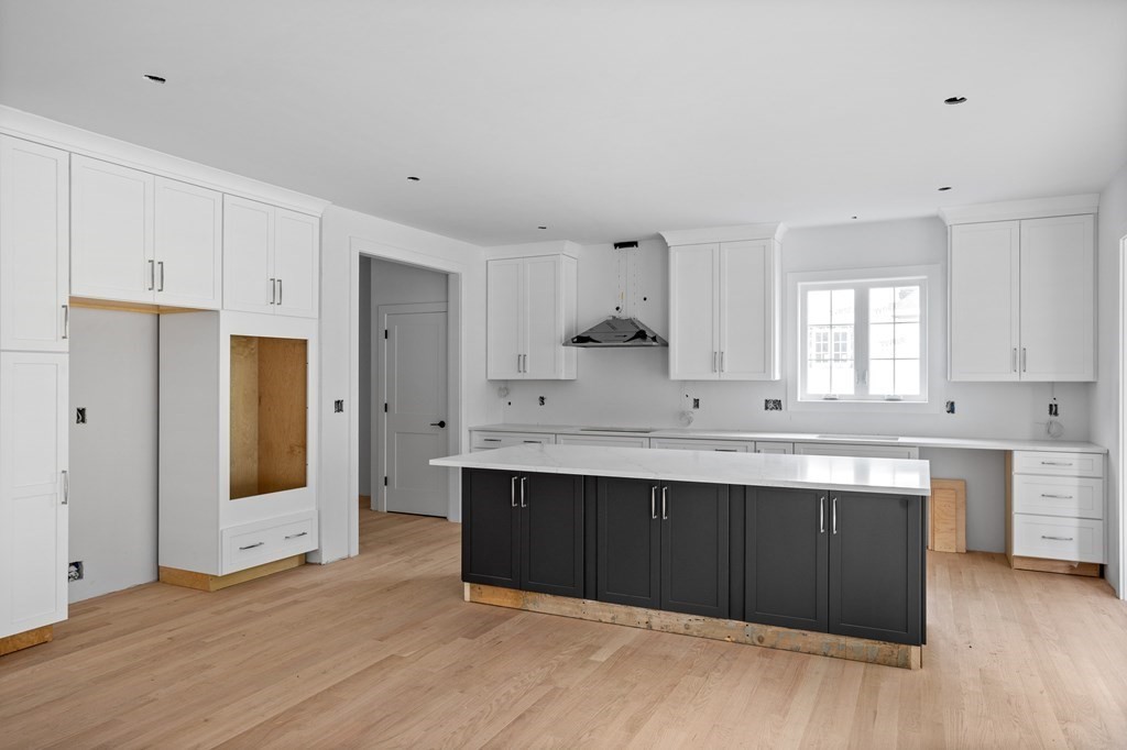 6 Nashoba Road Acton, MA 01720 - Photo 7 of 42 a view with kitchen island wooden cabinets and sink