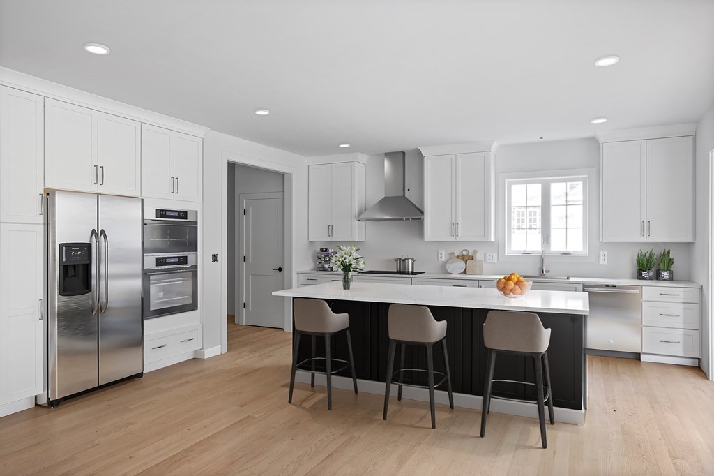 6 Nashoba Road Acton, MA 01720 - Photo 8 of 42 a kitchen with a sink a refrigerator and chairs