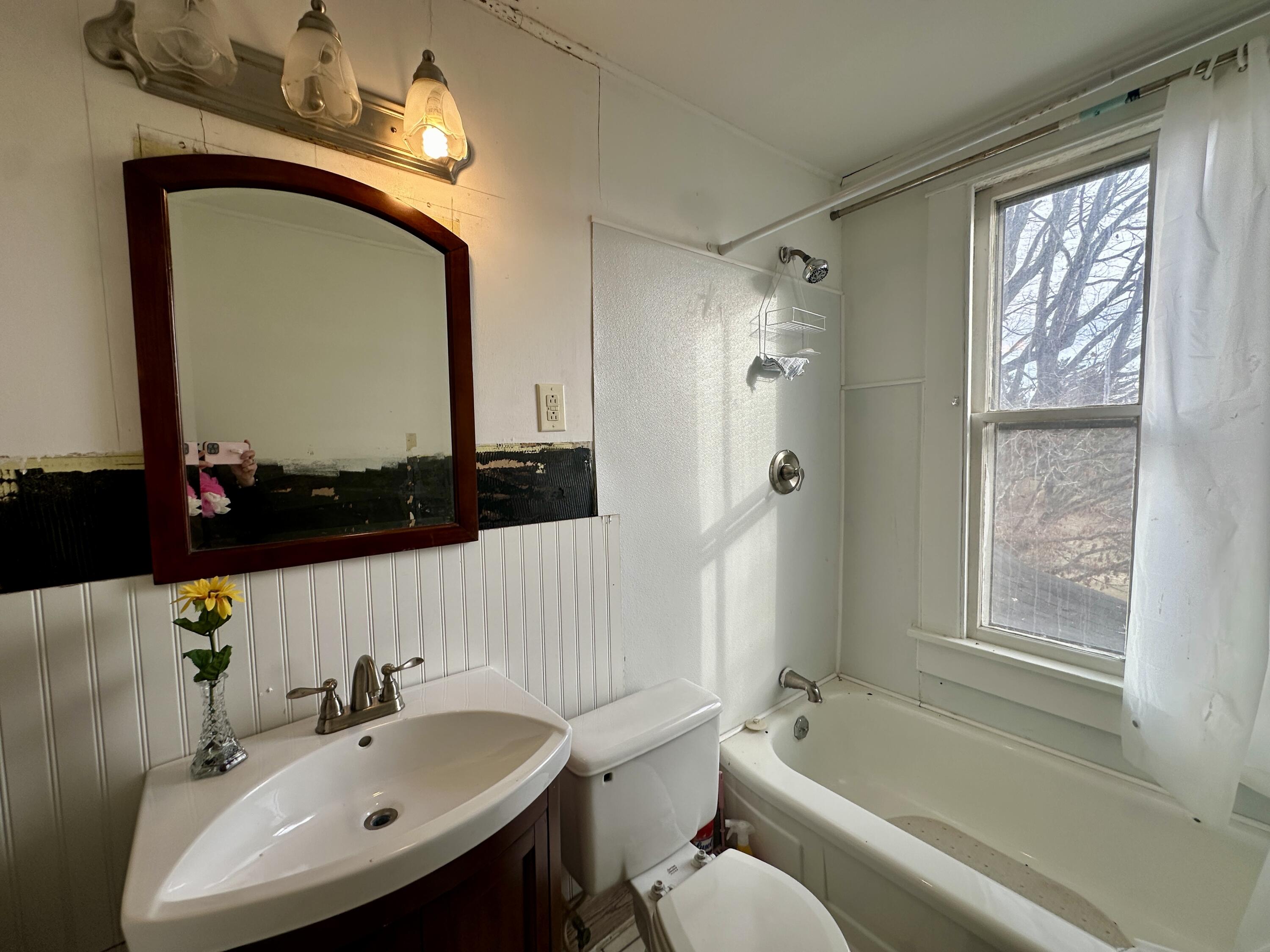 60 Soapstone Road Ridgeway, VA 24148 - Photo 14 of 26 a bathroom with a sink a bathtub and a mirror