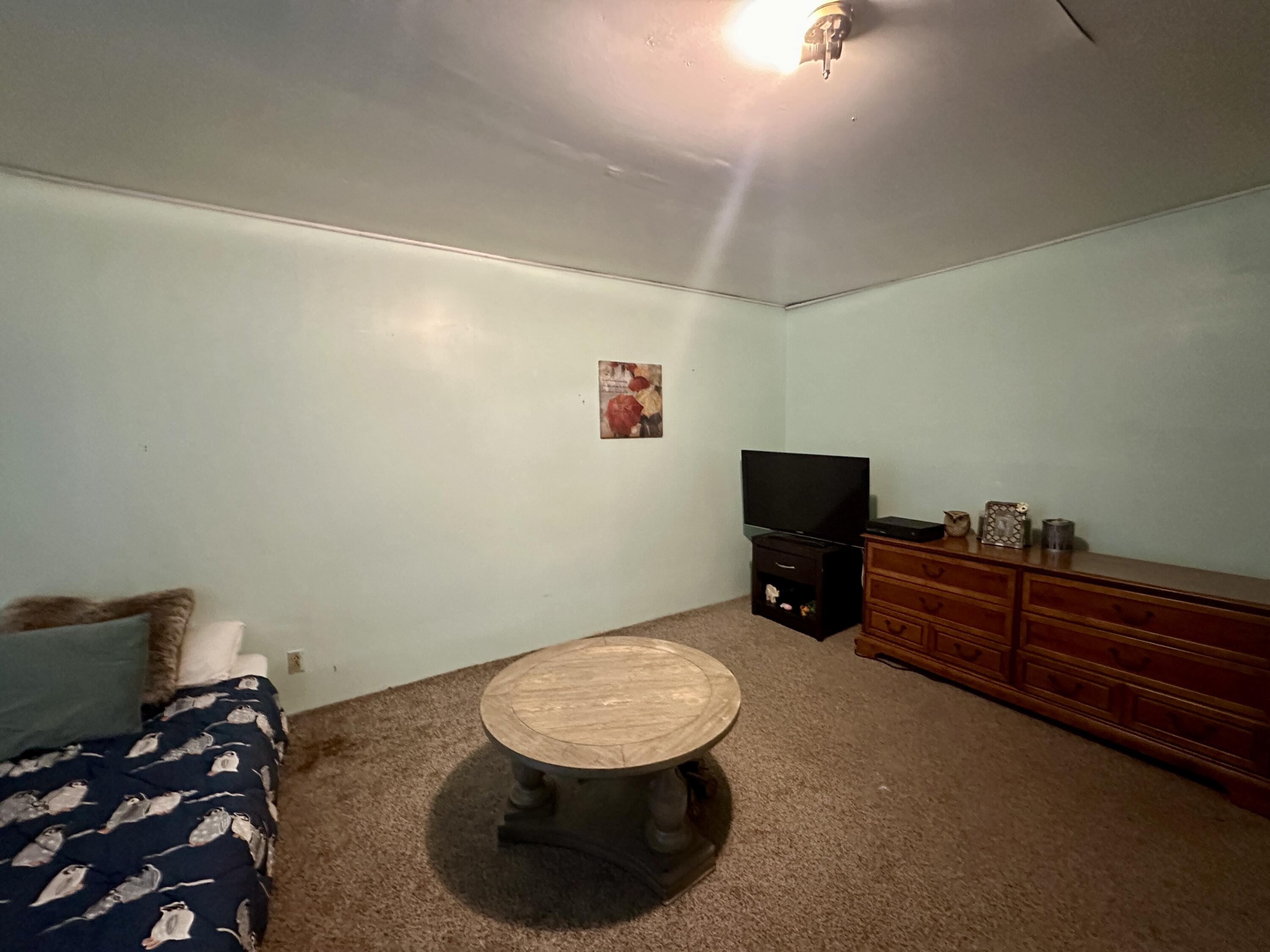60 Soapstone Road Ridgeway, VA 24148 - Photo 18 of 26 a room with a chair and a wooden floor