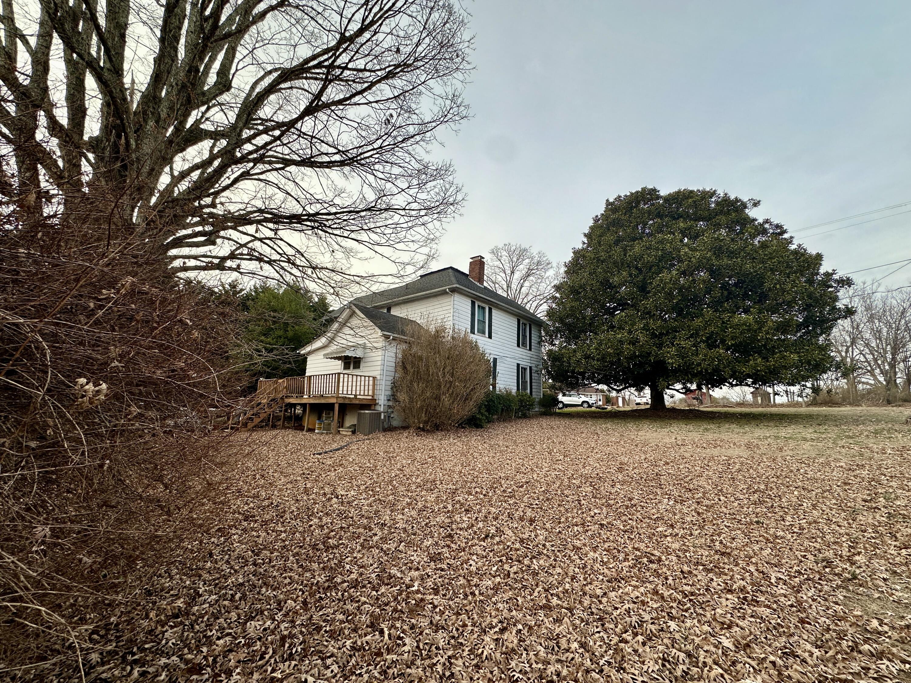 60 Soapstone Road Ridgeway, VA 24148 - Photo 21 of 26 a house with trees in front of it