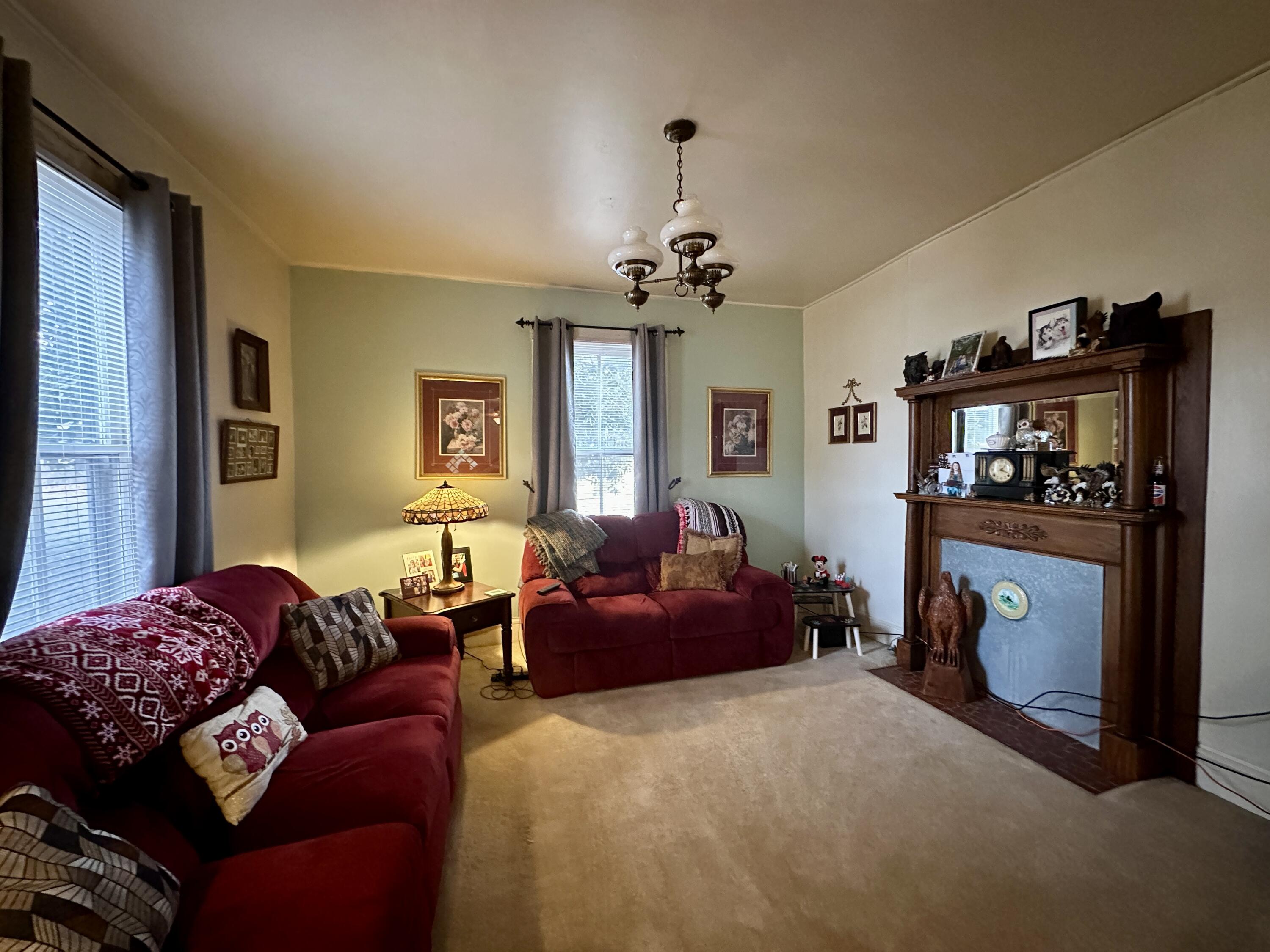 60 Soapstone Road Ridgeway, VA 24148 - Photo 5 of 26 a living room with furniture a window and a chandelier