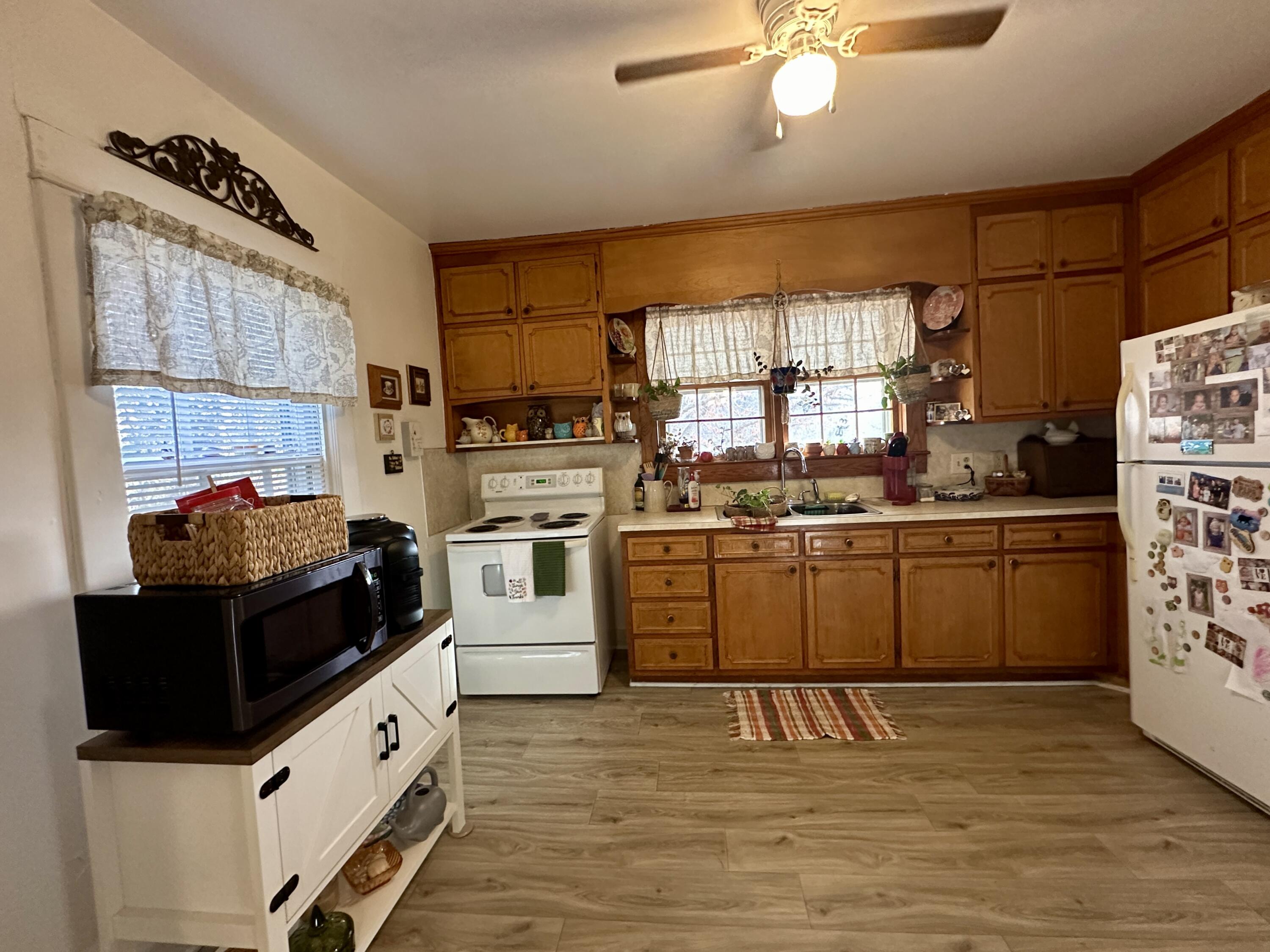 60 Soapstone Road Ridgeway, VA 24148 - Photo 7 of 26 a kitchen with stainless steel appliances kitchen island granite countertop a stove a sink and a refrigerator