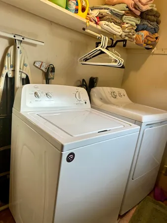 a utility room with dryer and washer