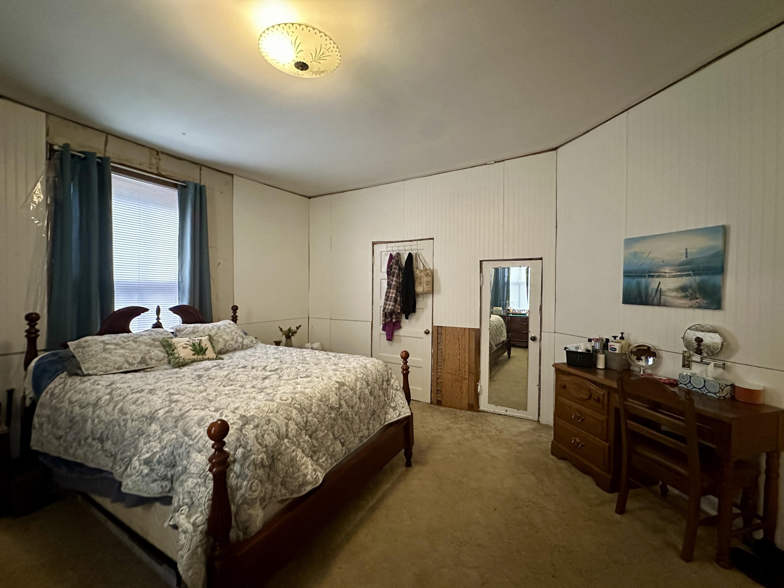 60 Soapstone Road Ridgeway, VA 24148 - Photo 10 of 26 a bedroom with a bed and a couch