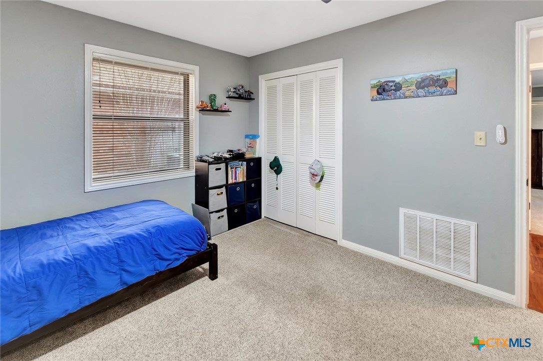 101 Kemble Street Victoria, TX 77904 - Photo 19 of 34 a bedroom with a bed and a window