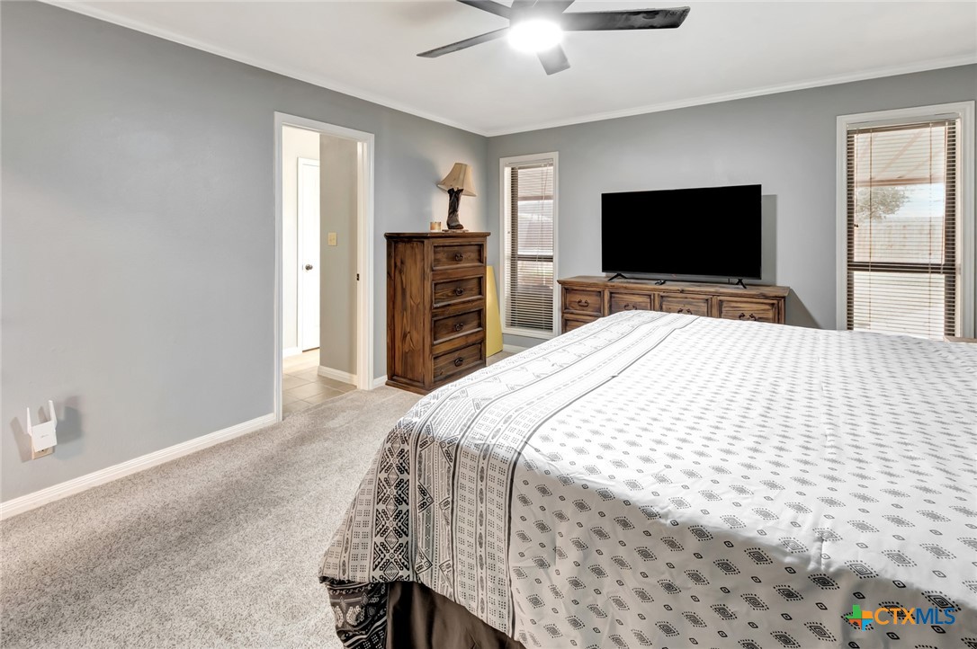 101 Kemble Street Victoria, TX 77904 - Photo 23 of 34 a bedroom with a bed and a flat screen tv