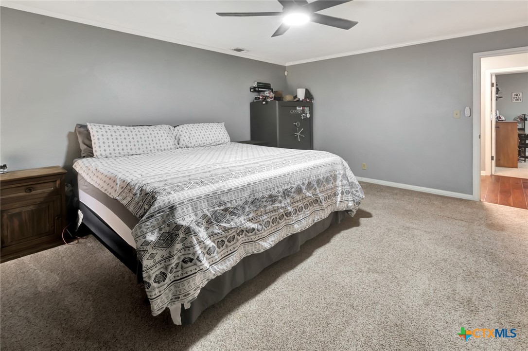 101 Kemble Street Victoria, TX 77904 - Photo 24 of 34 a bed sitting in a bedroom next to a window