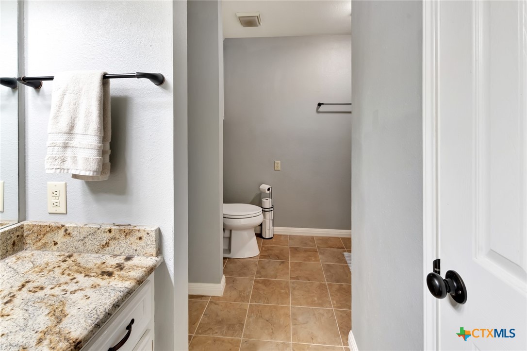 101 Kemble Street Victoria, TX 77904 - Photo 26 of 34 a bathroom with a sink toilet and shower