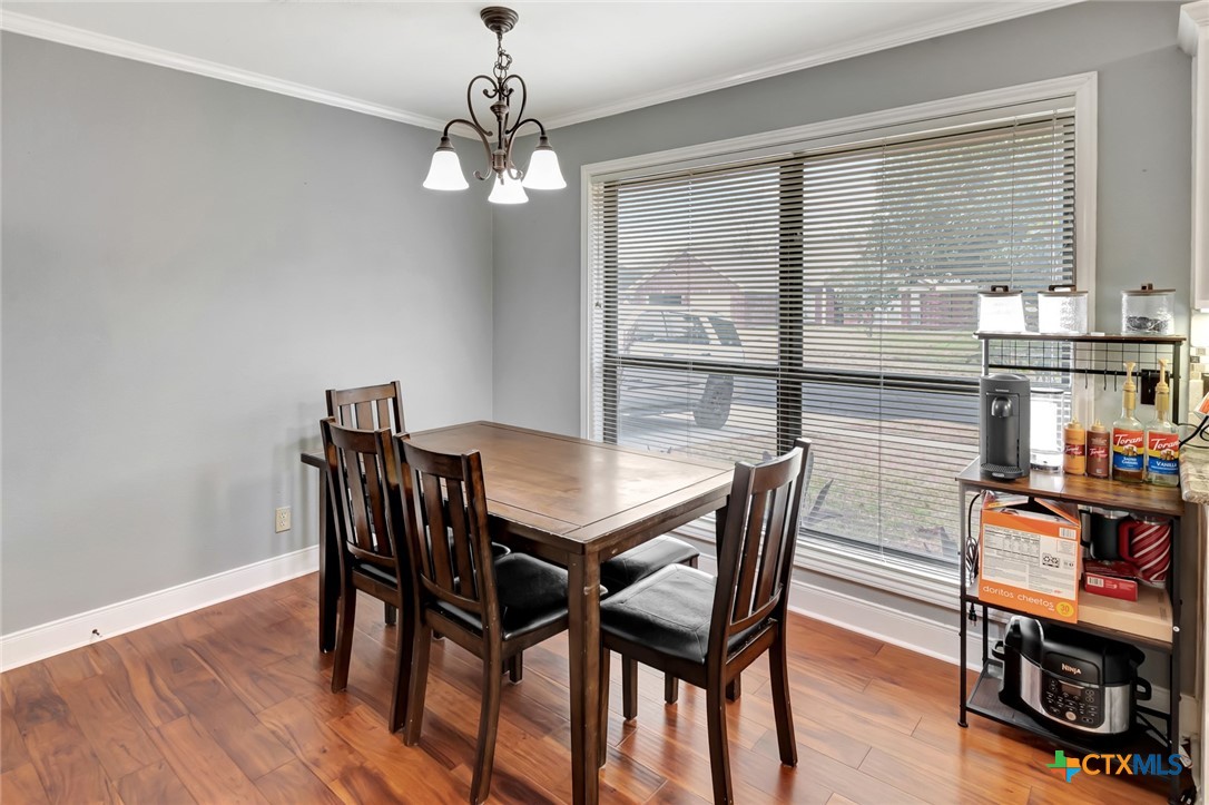 101 Kemble Street Victoria, TX 77904 - Photo 10 of 34 a view of a dining room with furniture window and wooden floor
