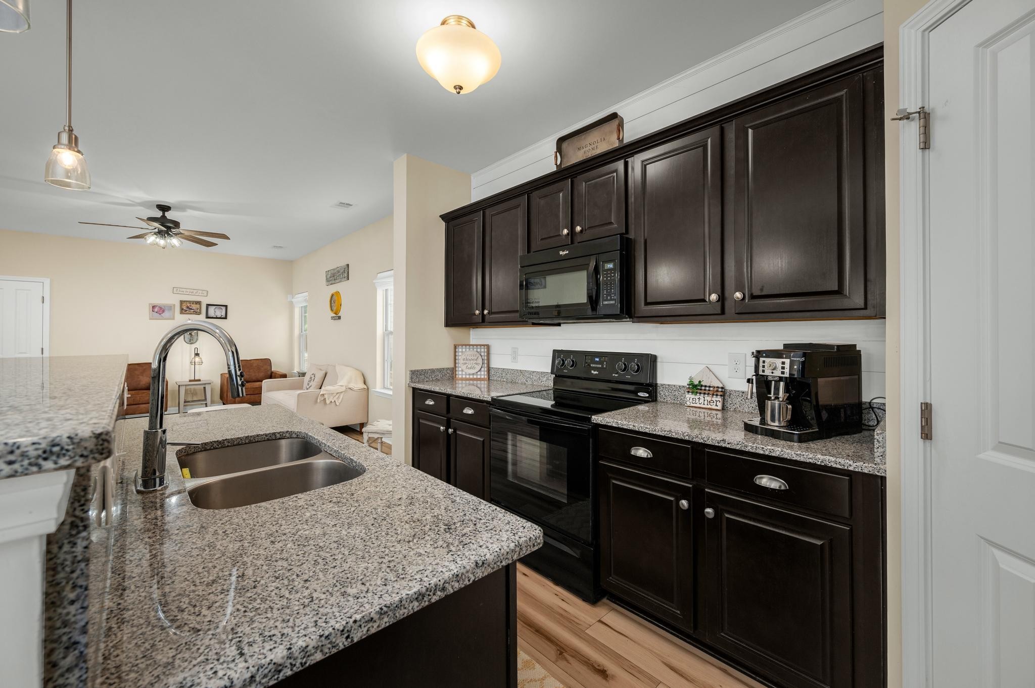 5003 Hemlock Court Spring Hill, TN 37174 - Photo 11 of 32 a kitchen with granite countertop a sink a stove and cabinets